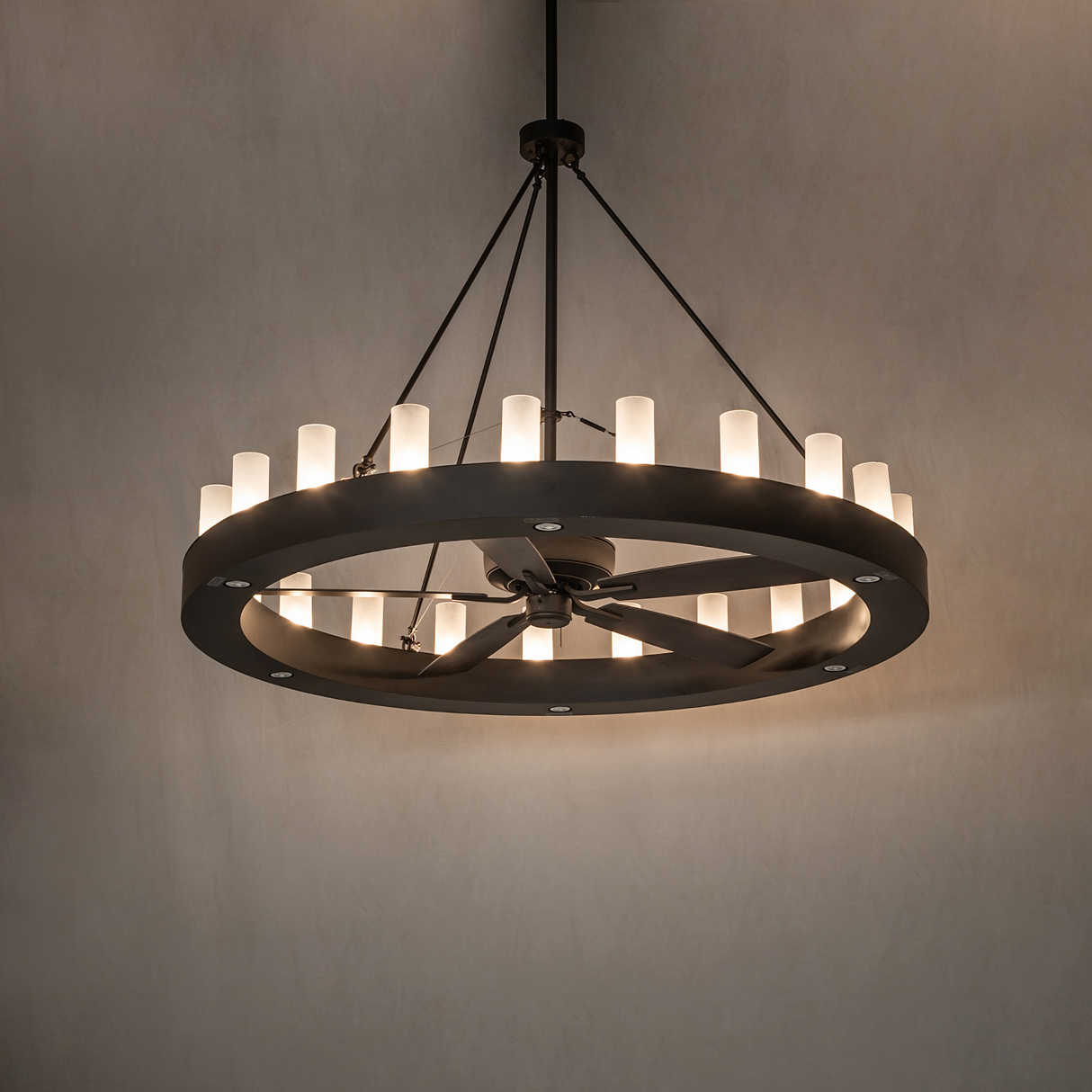 Ambient room view of brightly lit Loxley chandelier fan creating a warm modern glow.