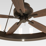Close-up of Loxley chandelier fan showing wooden fan blades and metal motor housing.