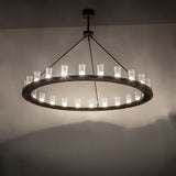 Loxley 24-light chandelier installed, glowing seeded glass cylinders creating warm ambient illumination.