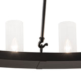 Closeup view of chandelier showing clear glass cylinder shades and solar black metal ring.