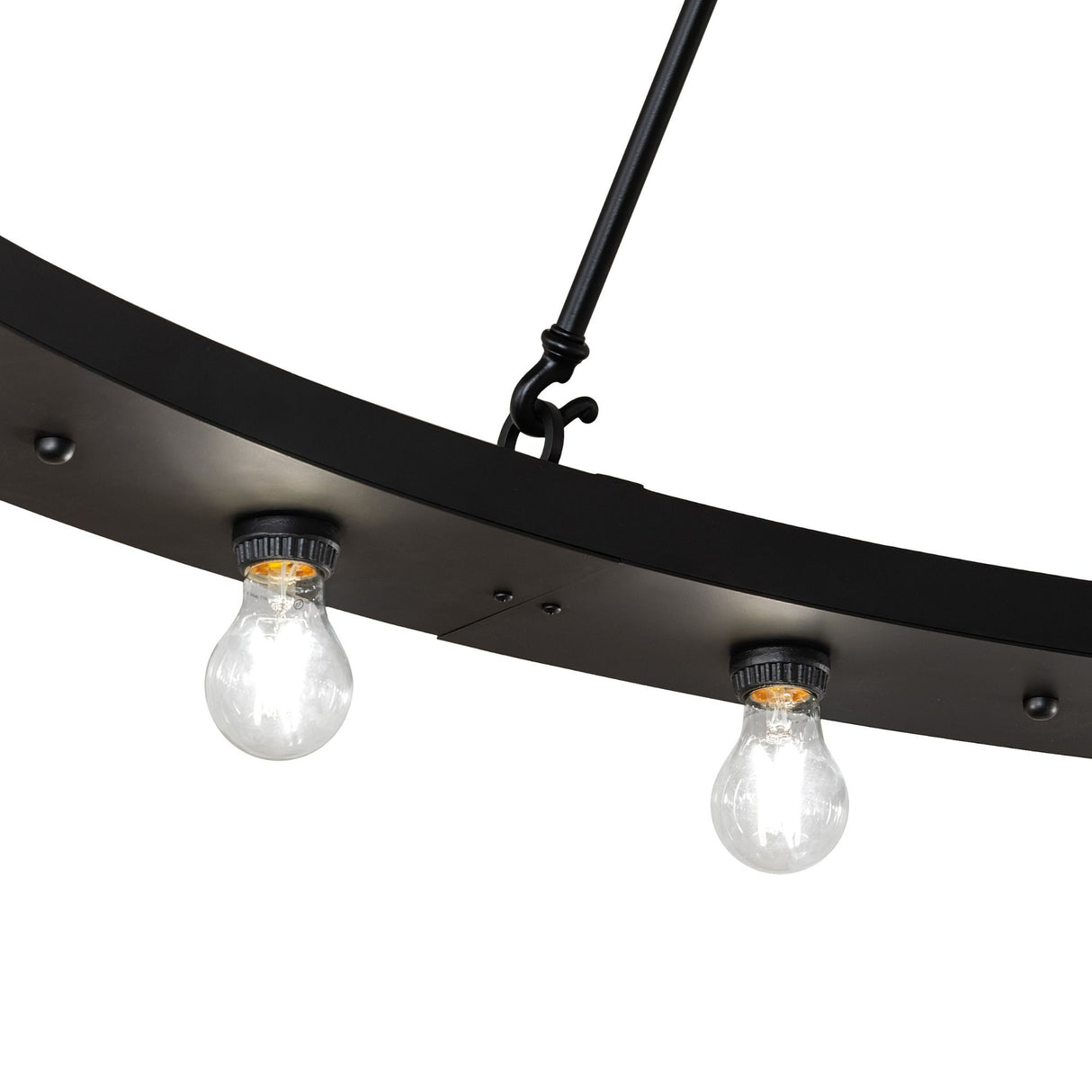 Close-up of black metal ring with mounted Edison bulbs on chandelier.