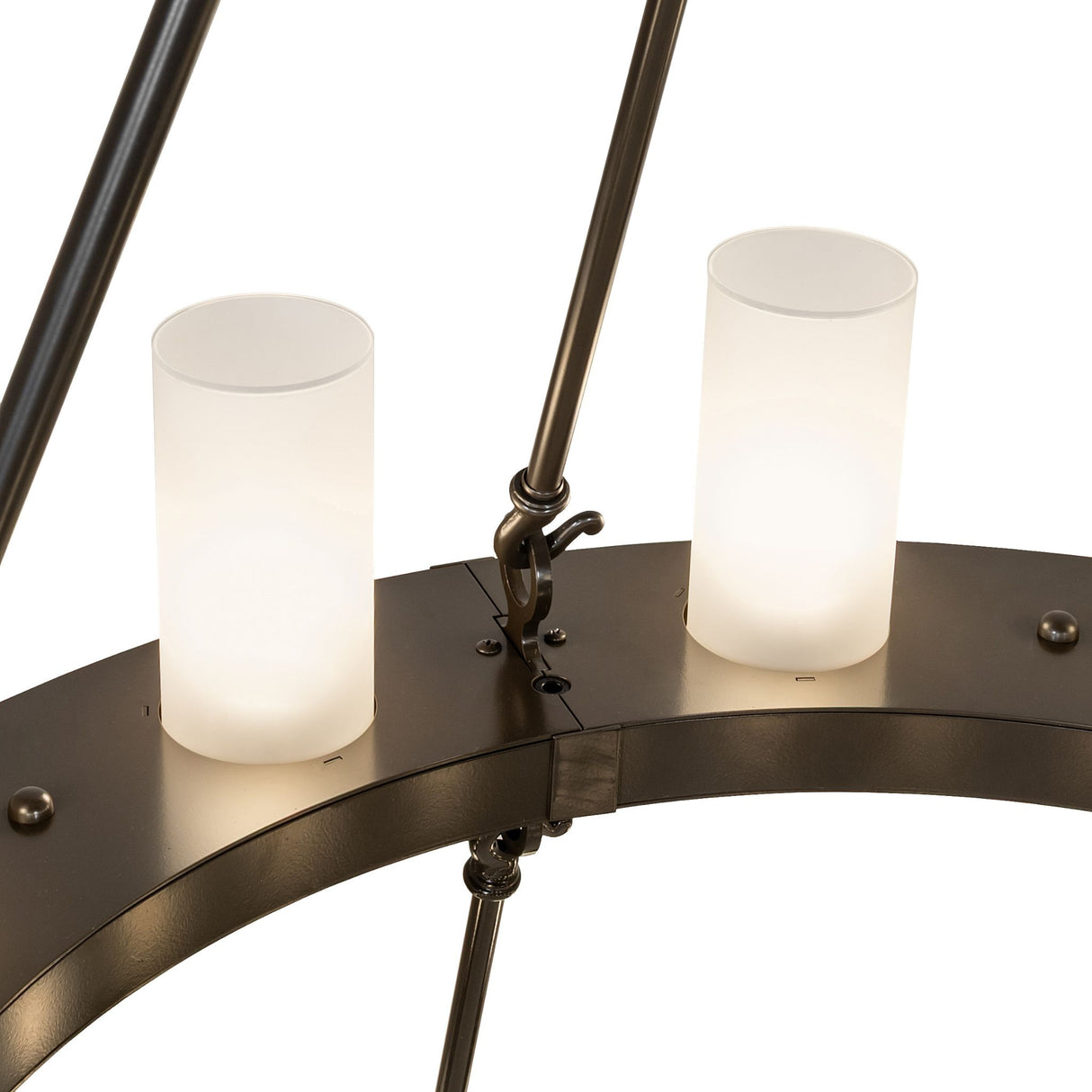 Close-up detail of frosted cylindrical glass shade mounted on the chandelier ring.