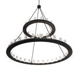 Bottom angle view of two tier chandelier with glowing glass cylinders.