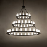Loxley three-tier chandelier creating soft ambient lighting in a modern interior.