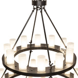 Close-up of the three-tier chandelier showing cylindrical glass lights mounted on circular ring.