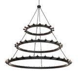 Lit view of the three-tier Loxley chandelier fully illuminated.
