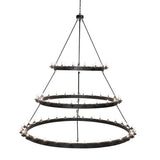 Side angled view displaying the chandelier’s structure of metal rings.