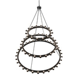 Top angled lit view highlighting the upper tiers and candle bulb layout.