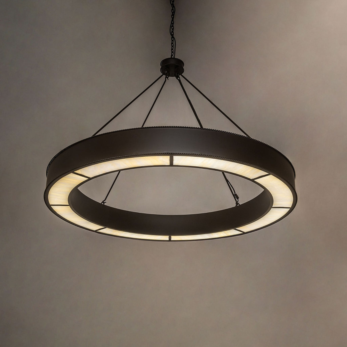 Loxley escabroso ring chandelier casting soft ambient LED illumination.