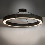 Loxley Escabroso semi-flushmount installed in interior space, casting warm ambient ceiling light.
