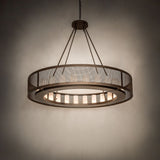 Ambient room view of the lit Loxley Golpe 24 light chandelier against a dark background.