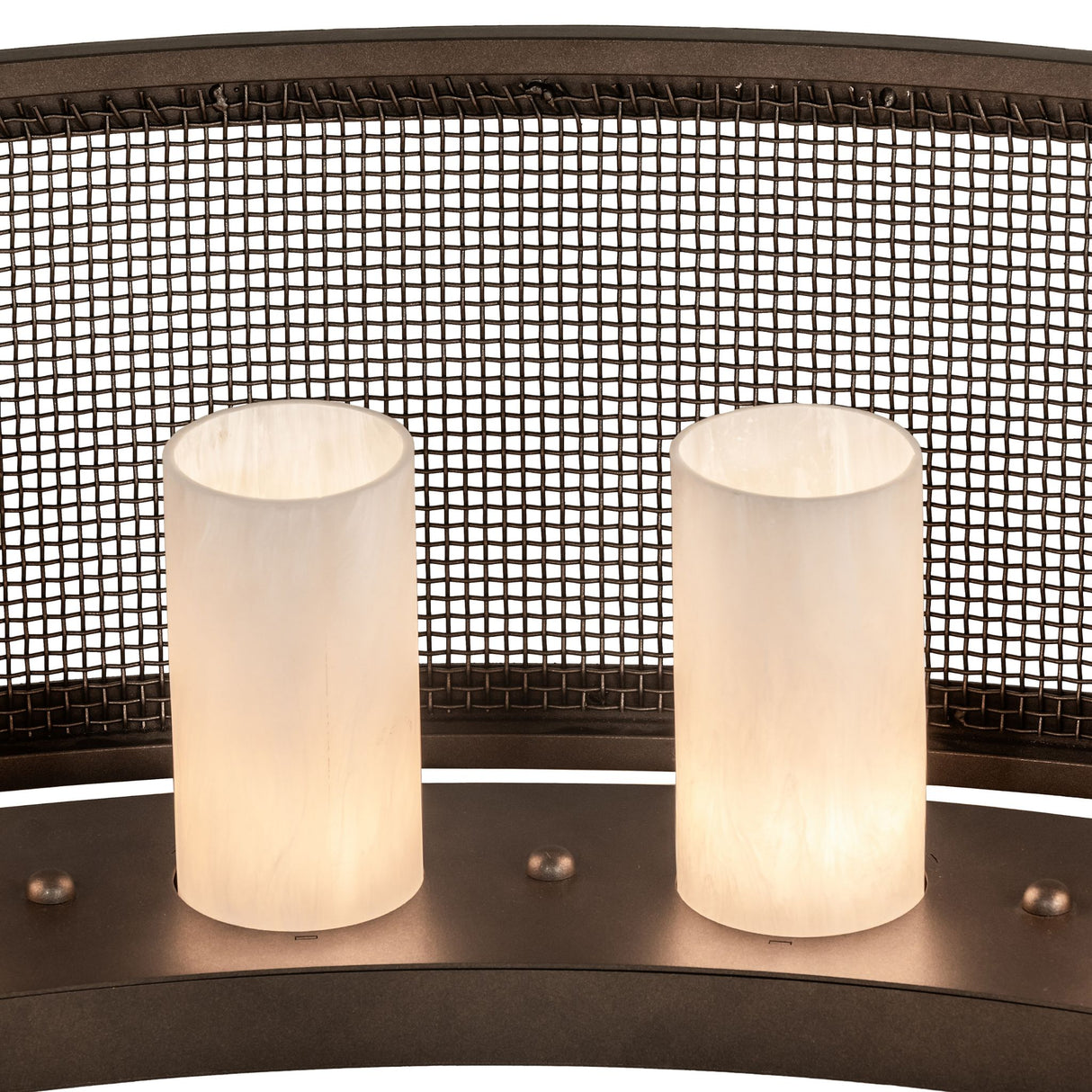 Close-up detail of lit cylindrical shades and mesh panel texture.
