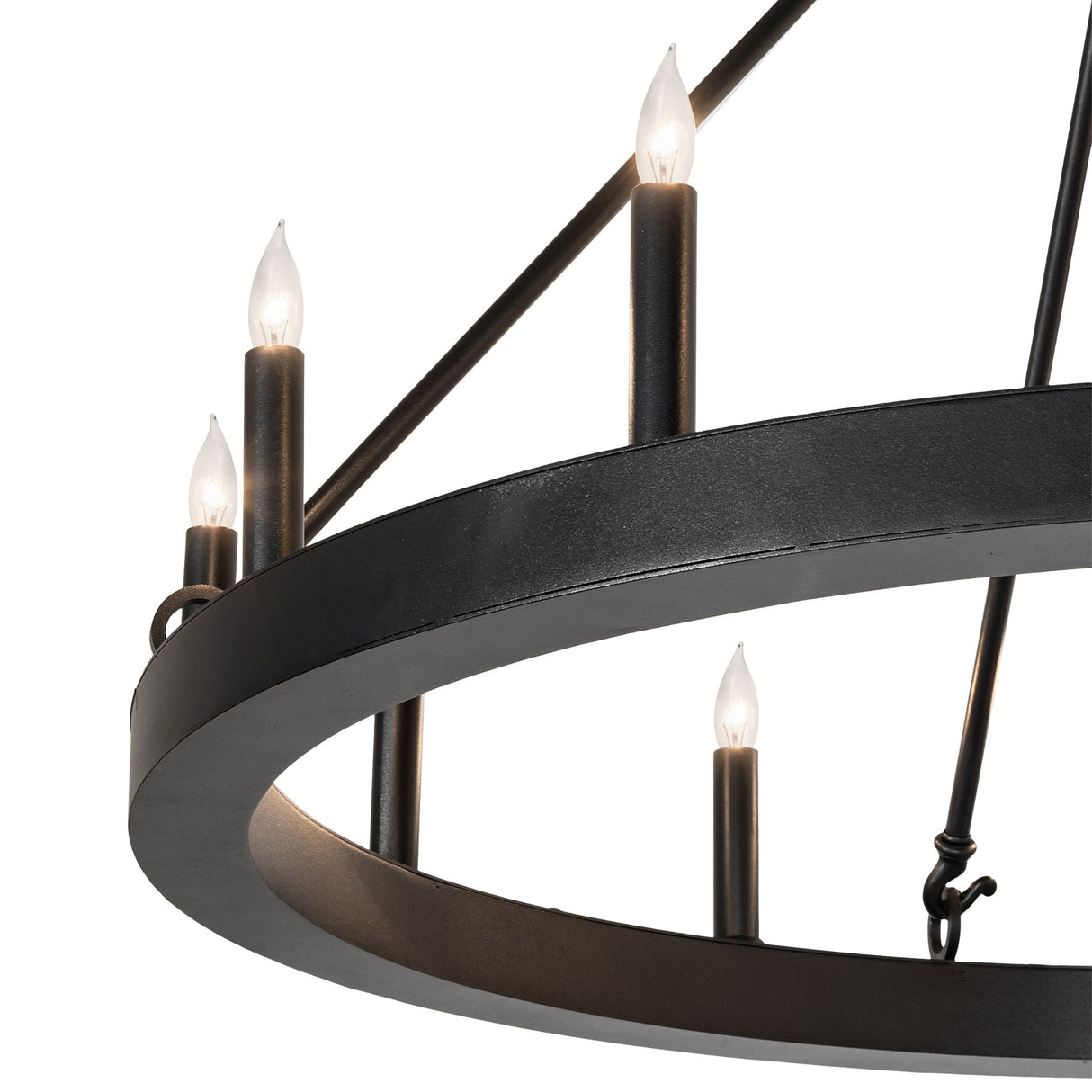 Close-up of chandelier circular metal ring with candle lights.