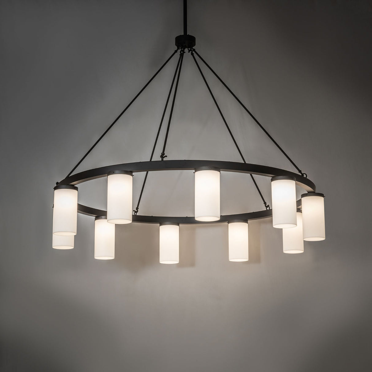 Ambient view of chandelier illuminated in interior setting.