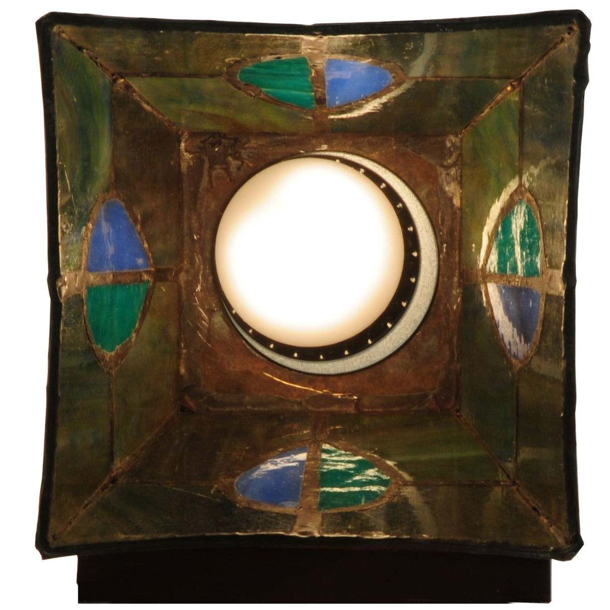 View of the sconce's stained glass shade from underneath.