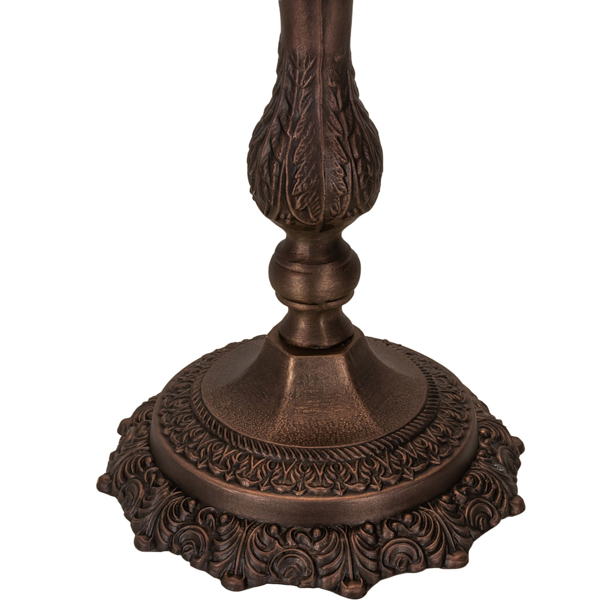 Close-up of bronze lamp base with intricate leaf detailing and scalloped edges.