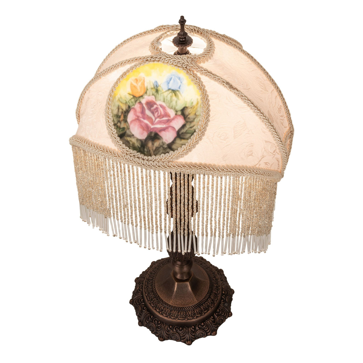 Top angled view of ivory fabric shade with bronze lamp base and fringe detail.