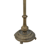 Foot switch detail on mahogany bronze floor lamp base for hands-free operation.