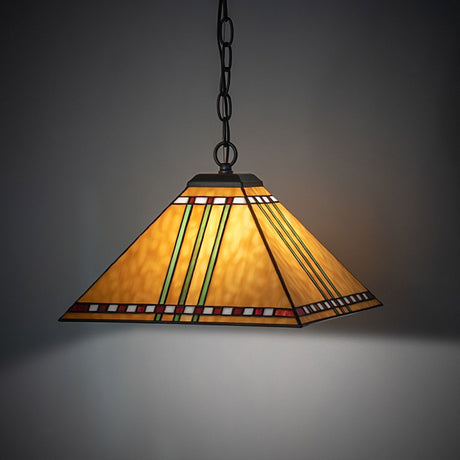 Pendant light lit in a cozy ambiance showing warm maize gold glass.