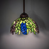 Illuminated view of the Tiffany Honey Locust Pendant with Mahogany Bronze finish.