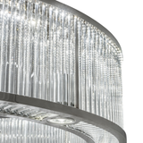 Closeup of illuminated glass rods reflecting bright LED glow.