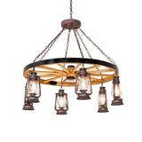 Lit view of Miners Lantern wagon wheel chandelier with six lantern lights.
