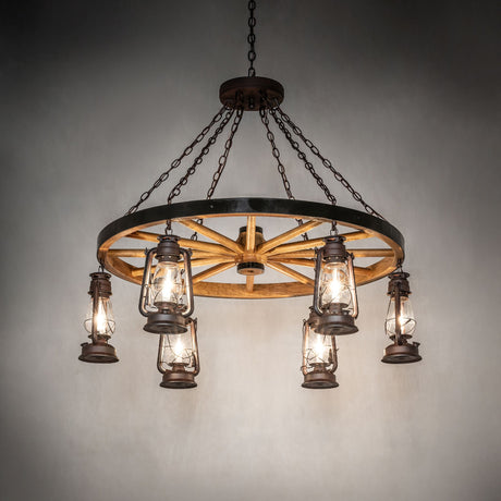 Miners Lantern wagon wheel chandelier illuminated in interior setting.