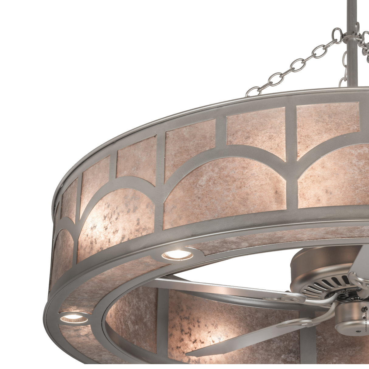 Close-up lit view showing mica texture and curved geometric metal pattern.