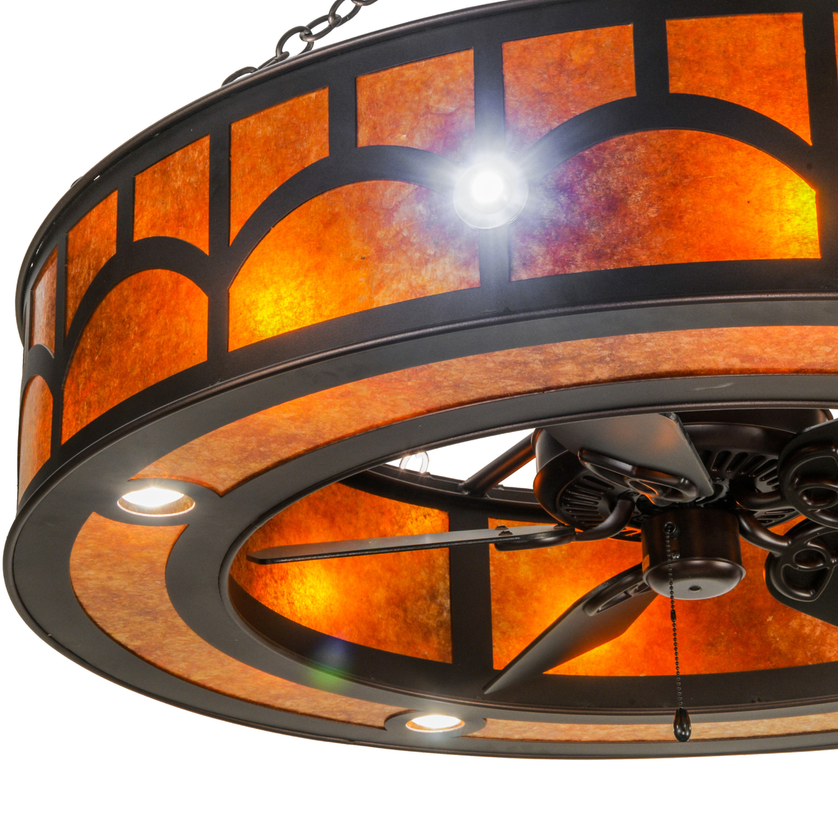 Closeup of light fixture detail with brushed metal trim and glow.