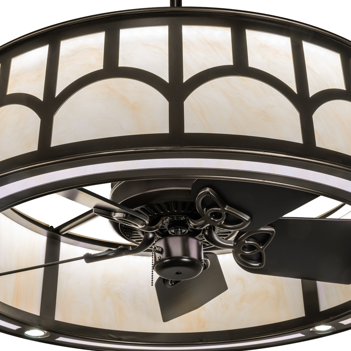 Close-up of integrated fan with LED lighting and bronze detailing.
