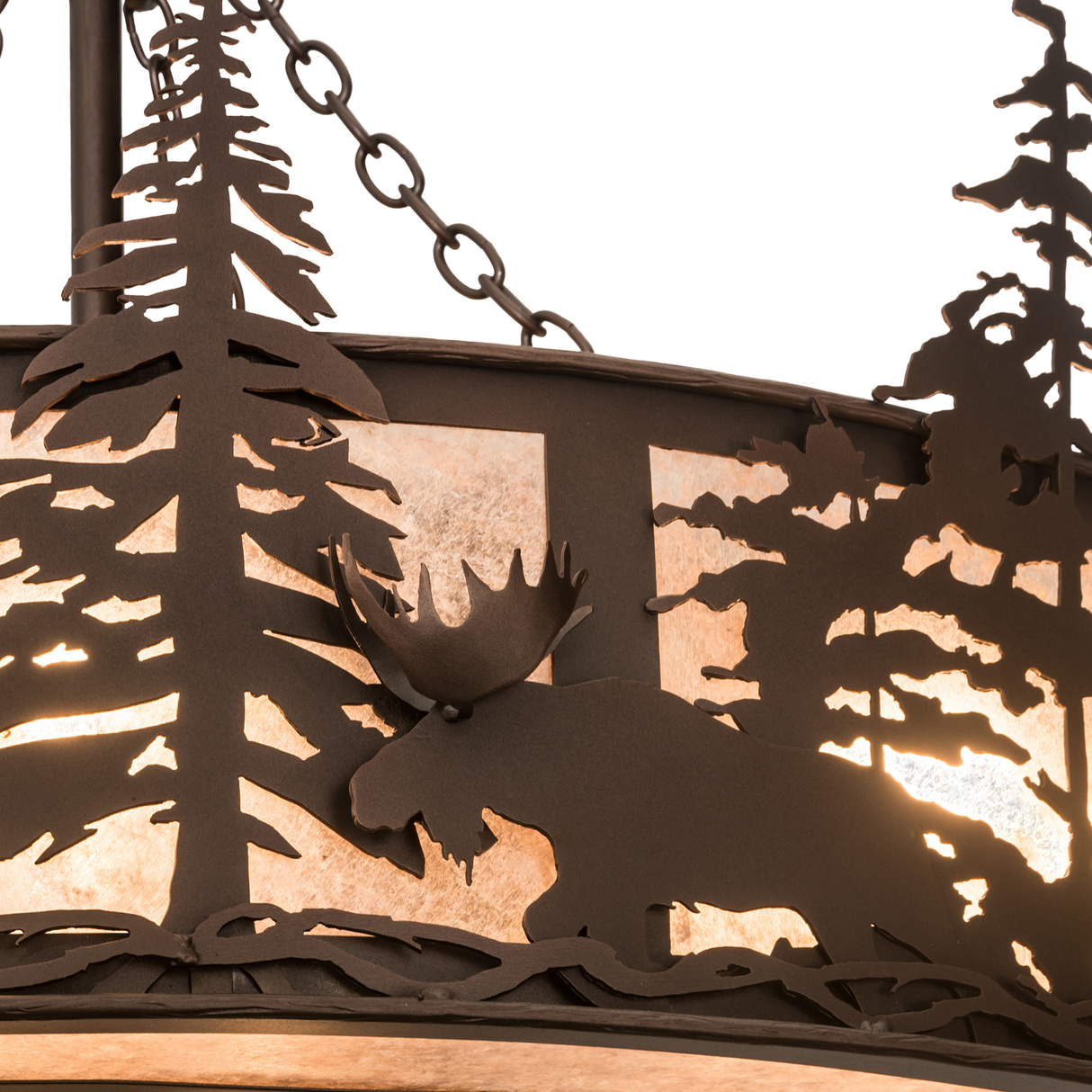Close-up of moose and pine tree silhouette on mica diffuser panel.