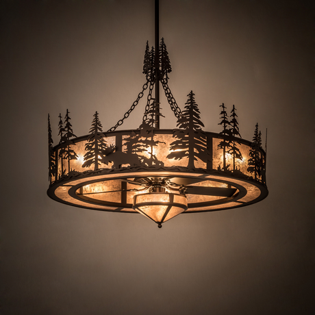 Moose at Dusk chandelier illuminated in room, casting a warm rustic glow.