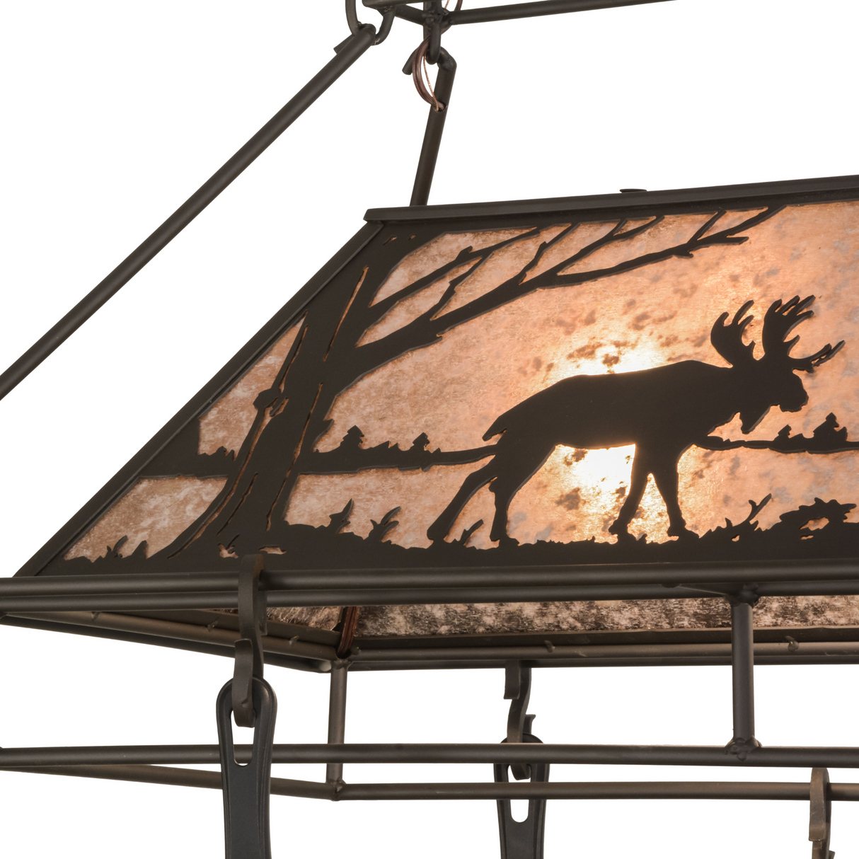 Closeup of moose silhouette and warm mica glow.