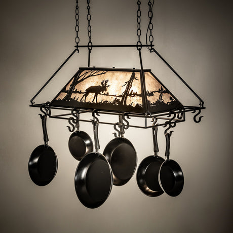 Moose chandelier pot rack glowing with warm light.