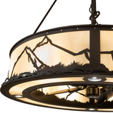 Close-up detail of mountain silhouette and softly illuminated Idalight shade.