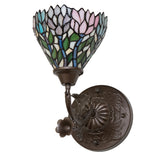 Vibrant Wisteria wall sconce with a colorful floral theme and bronze base.