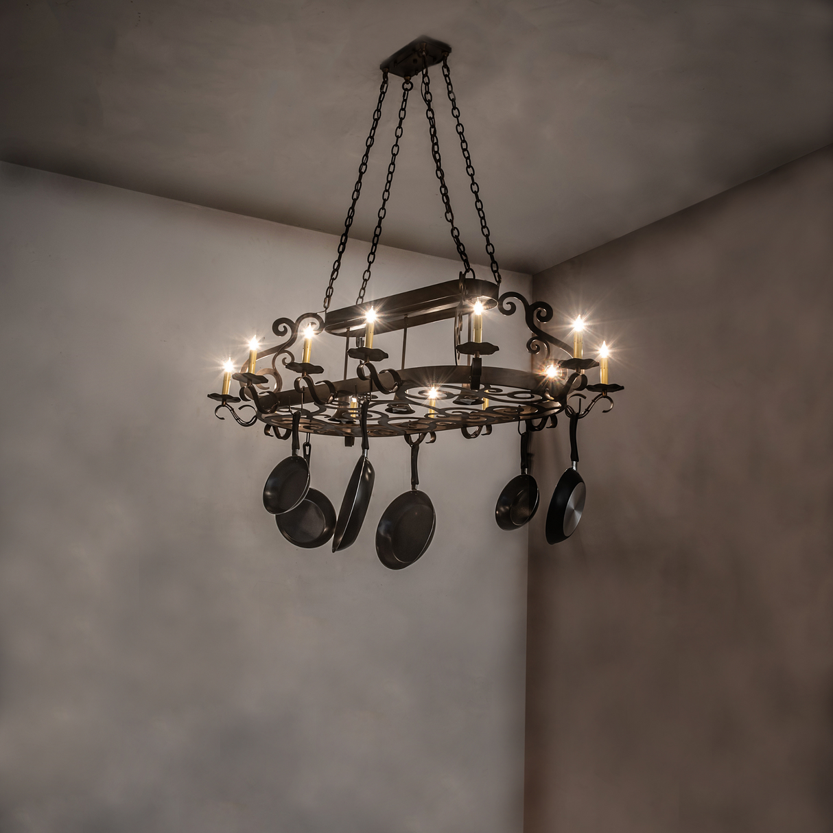 Neo 15 light pot rack chandelier illuminated in room setting.