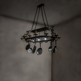 Neo 15 light chandelier in room with lights dimmed.