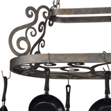 Close-up of scroll detail and hanging pan hooks.