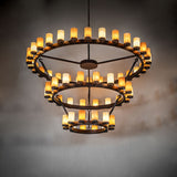 Noziroh three-tier ring chandelier providing warm ambient lighting in a large interior space.