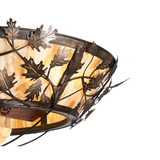 Close-up of Oak Branch chandelier showing leaf design and metal texture.