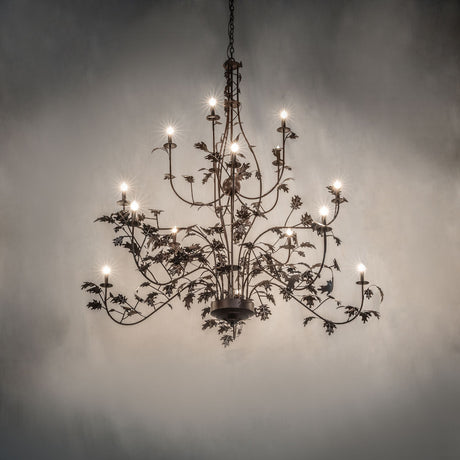 Oak leaf chandelier shown in ambient room setting with warm glowing candle style lights.