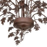 Bottom detail of chandelier showing sculpted oak leaf accents and Cafe Noir metal finish.
