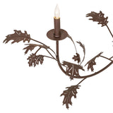 Close-up of faux candle light with oak leaf accents on rustic oak leaf chandelier.