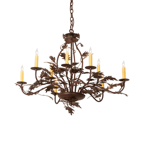 Lit view of the oak leaf 9 light chandelier glowing warmly.
