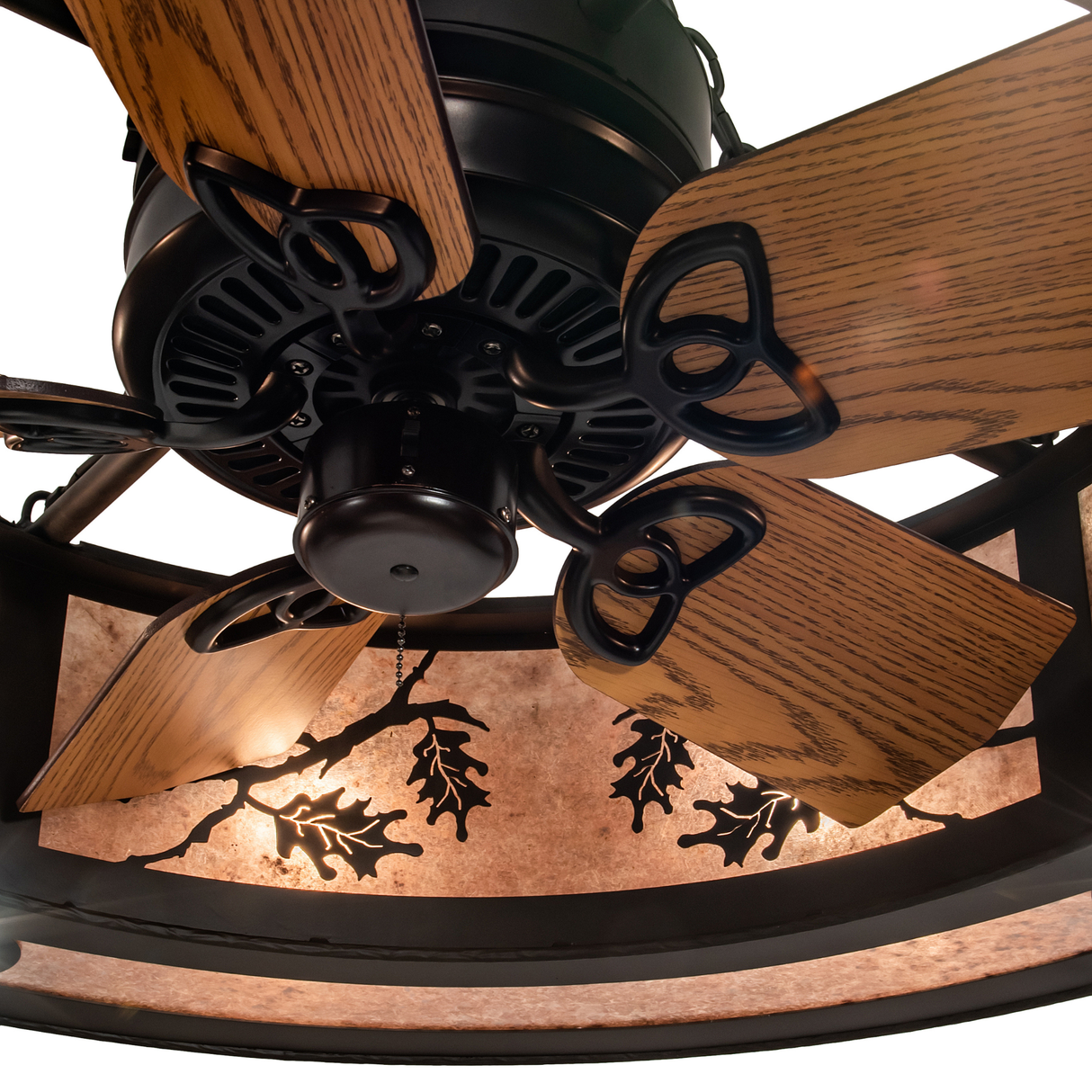 Close-up of integrated fan beneath illuminated oak leaf panels.