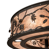Close-up of silver mica diffuser with oak leaf overlay design.