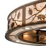 Close-up of handcrafted oak leaf cutouts on mica diffuser.