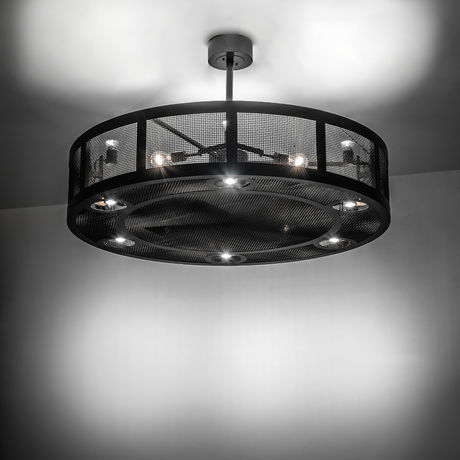 Illuminated Paloma Golpe chandelier fan glowing in ambient light.