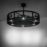 Paloma Golpe chandelier fan illuminated in a dark modern room.
